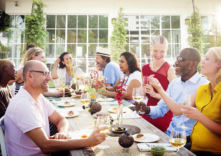 People happy eating at a table together